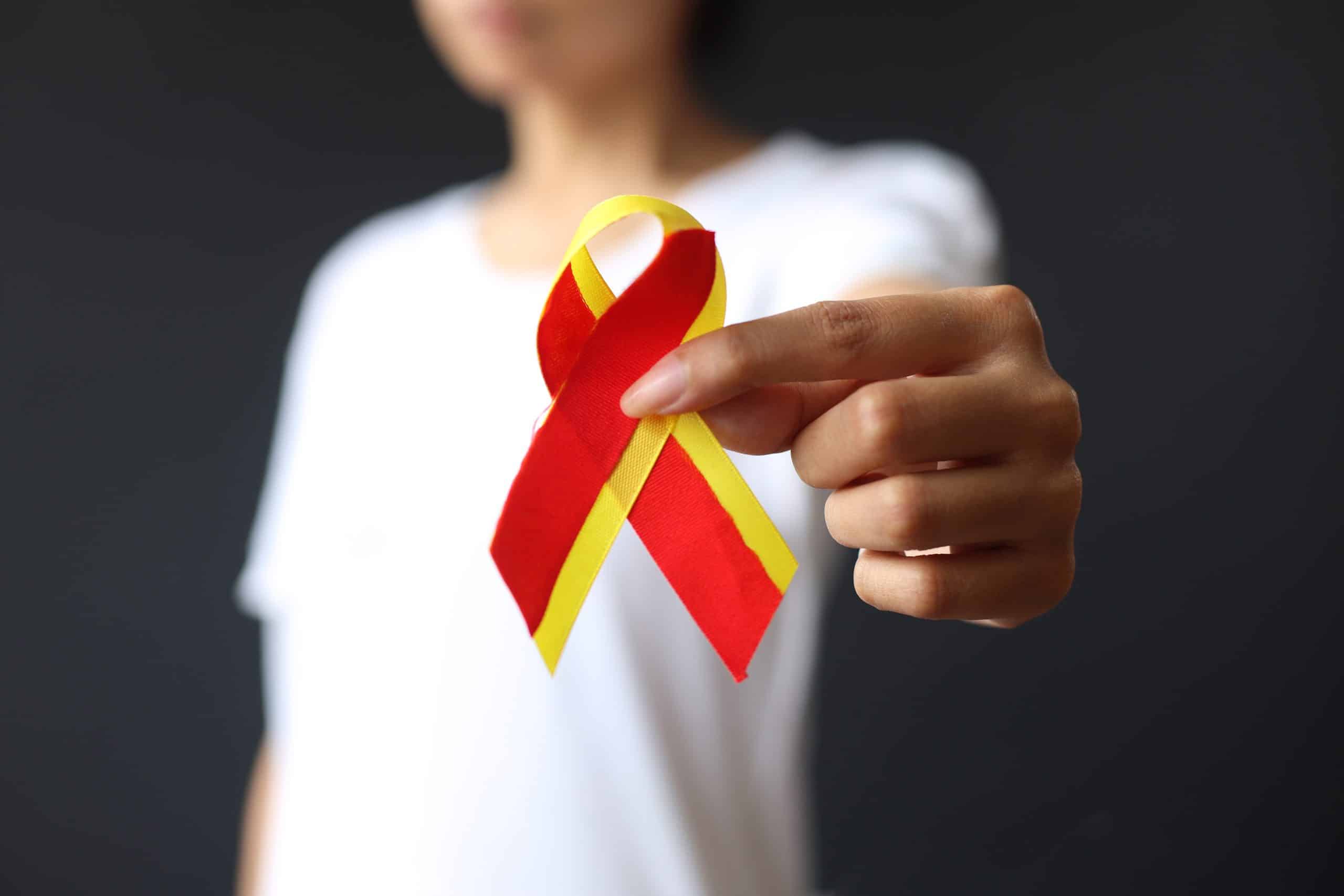 World,Hepatitis,Day.,Woman,Holding,Red,Yellow,Ribbon,And,Showing