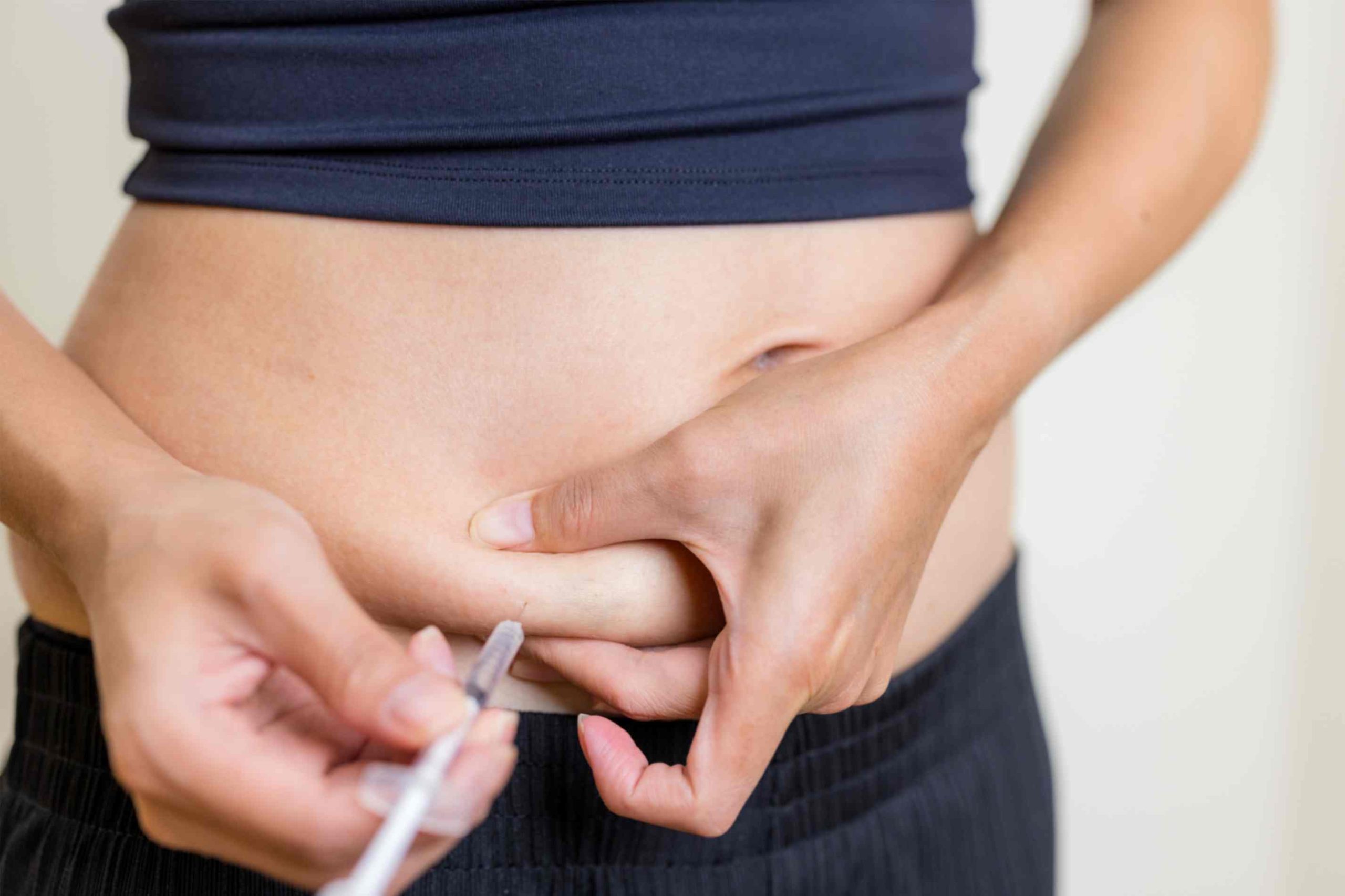 Person-injecting-Wegovy-in-the-abdomen-for-weight-loss