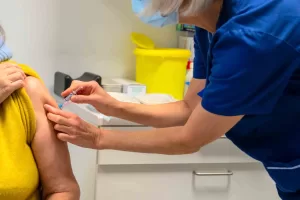 common side effects of travel vaccines in the UK