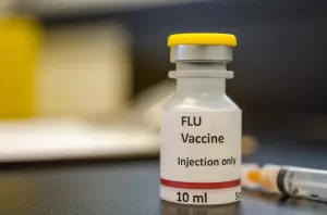 why flu vaccine may cause mild symptoms